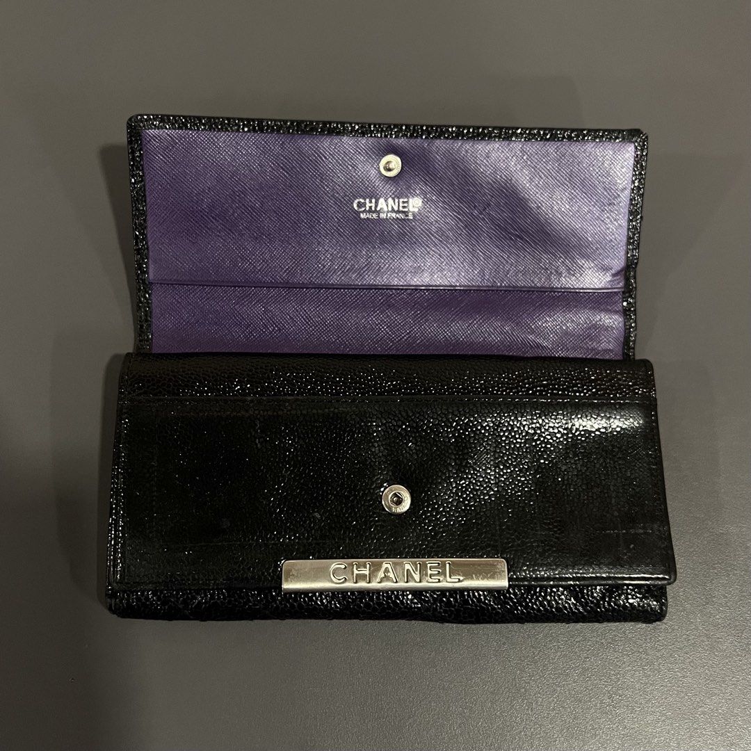 Chanel Black Caviar Leather Long Wallet (Category: Wallets & Card holders) located in M'Lang. Submitted by alexpabillo0324 (Listing ID 1464035811, Image 2). Description: - Authentic Chanel Long Wallet - Material: Black Caviar Leather - Design: Classic quilted pattern - Hardware: Silver Chanel logo - Interior: Vibrant purple lining - Features: Multiple card slots, zippered compartment - Authenticity: Serial number sticker included - Benefit: Perfe