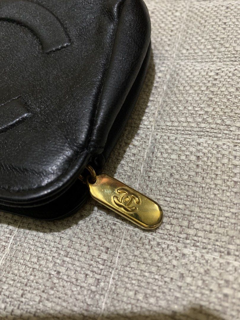Chanel Black Leather CC Logo Pouch (Category: Luxury Bags & Wallets) located in Quezon City. Submitted by ncjnc (Listing ID 1464076562, Image 3). Description: - Genuine black leather pouch - Embossed CC logo detail - Gold-tone zipper and charm - Convenient small wrist strap - Ideal for makeup, cosmetics, or daily essentials - Approximate dimensions: 7 inches wide x 4 inches tall - Zipper operates smoothly - Shows minor signs of wear on leather an