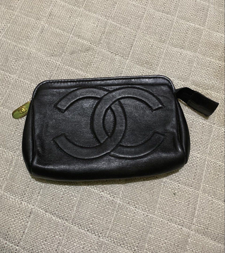 Chanel Black Leather CC Logo Pouch (Category: Luxury Bags & Wallets) located in Quezon City. Submitted by ncjnc (Listing ID 1464076562, Image 1). Description: - Genuine black leather pouch - Embossed CC logo detail - Gold-tone zipper and charm - Convenient small wrist strap - Ideal for makeup, cosmetics, or daily essentials - Approximate dimensions: 7 inches wide x 4 inches tall - Zipper operates smoothly - Shows minor signs of wear on leather an