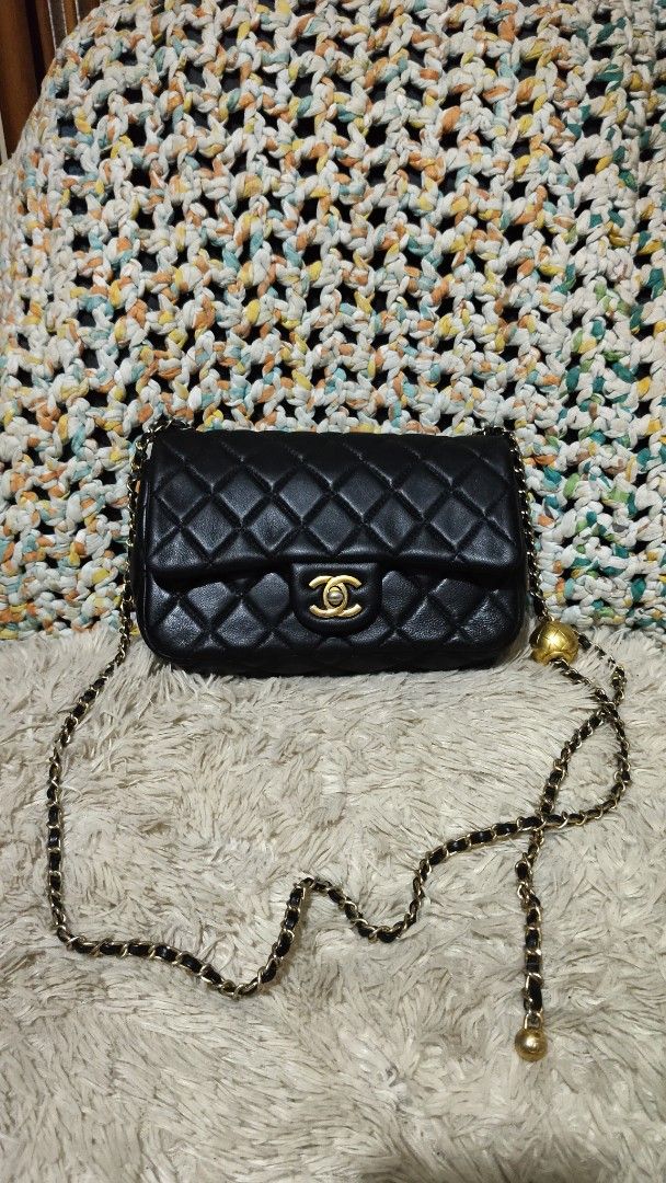 Chanel Black Quilted Leather Chain Shoulder Bag (Category: Cross-body Bags) located in Cebu City. Submitted by lumaynojes00490 (Listing ID 1463961737, Image 1). Description: - Classic Chanel flap bag - Black quilted leather - Gold hardware - Iconic CC logo clasp - Chain strap with interwoven leather - Small ball charm on strap - Versatile for day or night use.