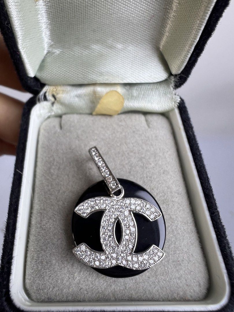 Chanel CC Diamond Pendant 925 Sterling Silver (Category: Necklaces) located in Baguio. Submitted by chiechie1234 (Listing ID 1463983010, Image 2). Description: - Genuine Chanel CC logo pendant - Accented with small diamonds on CC logo and bail - Stamped '925' for sterling silver - Perfect addition to your jewelry collection.
