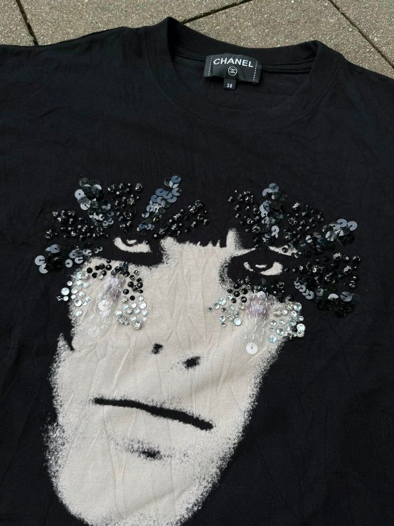 Chanel Cruise 2022 Beaded Tee (Category: Luxury Apparel) located in Davao. Submitted by thriftnijanny (Listing ID 1464054900, Image 2). Description: Chanel Beaded and Embellished T-Shirt Dimentions 20x27 Color rate: 10/10 Issue: the strand of bead loose a little but still complete.