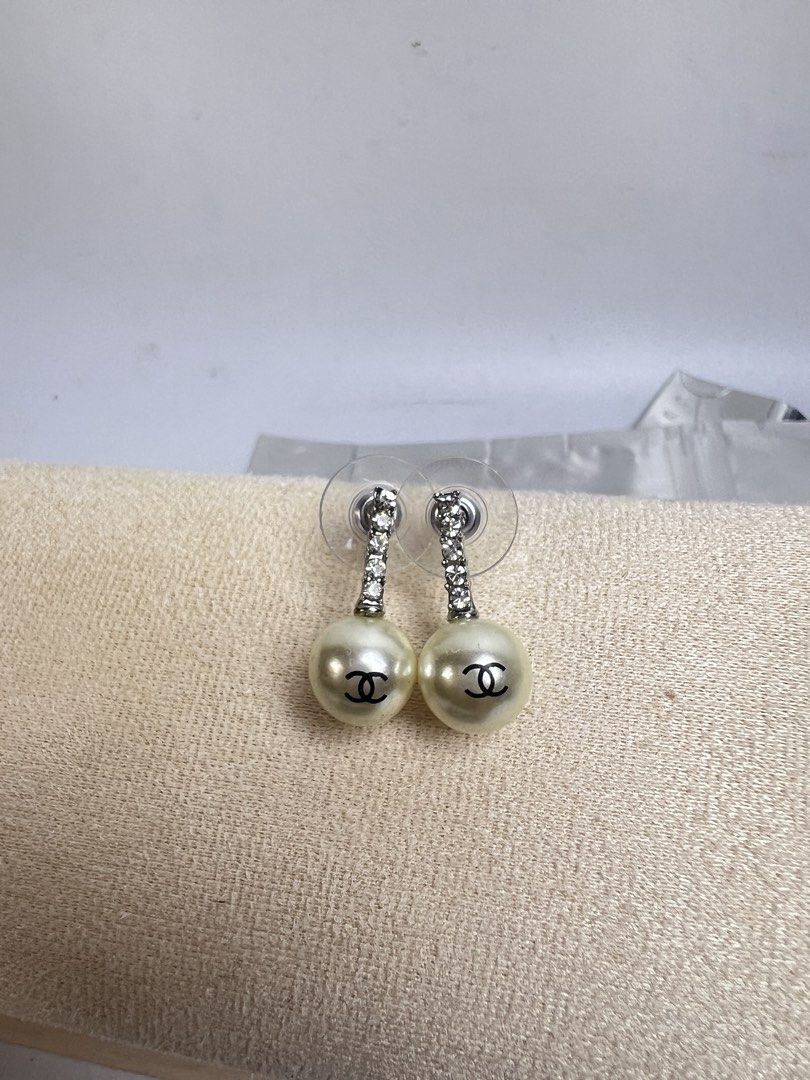Chanel Pearl Drop Earrings with Crystals (Category: Earrings) located in Baguio. Submitted by chiechie1234 (Listing ID 1463982625, Image 2). Description: - Classic Chanel pearl drop earrings - Features iconic CC logo on pearls - Accented with sparkling crystal studs - Elegant and timeless design - Perfect for elevating any outfit - A must-have for fashion enthusiasts.
