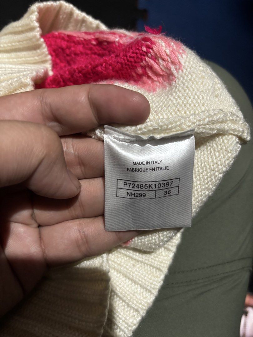 Chanel White Wool Knit Sweater Size 36 (Category: Coats, Jackets and Outerwear) located in Caloocan City. Submitted by neweagle-424b (Listing ID 1464064455, Image 3). Description: W 19 - 20 x 19 L white wool knit sweater - Size 36 - Half-zip turtleneck design - Unique pink and red abstract pattern on front and sleeves - Bold blue '5' graphic on the back - Made in Italy.