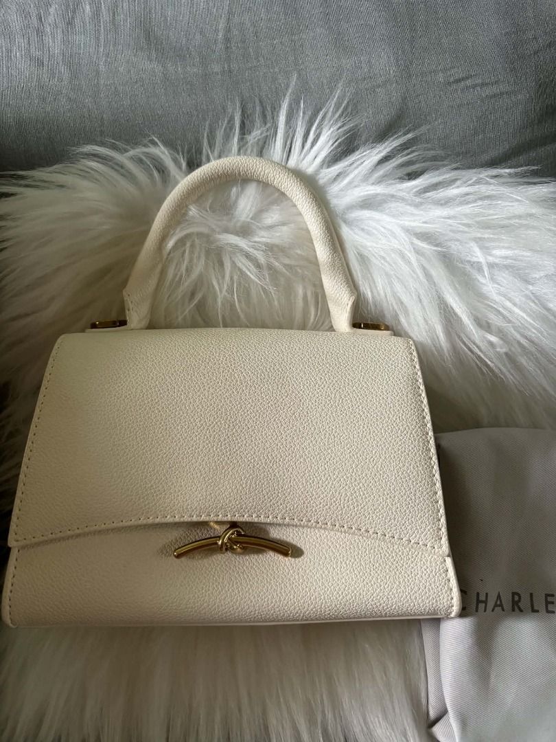Charles & Keith Cream Textured Top Handle Bag (Category: Shoulder Bags) located in Davao. Submitted by airadspbls (Listing ID 1463944762, Image 1). Description: PRELOVED CHARLES AND KEITH HUXLEY BAG ✨️ Good condition. 📌 RFS: not using anymore 📍 Location: Polomolok, South Cotabato 100% AUTHENTIC 💯 Money-back guarantee if proven fake. .