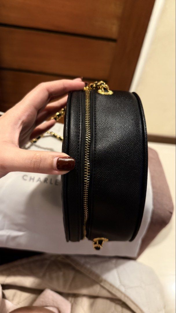 Charles & Keith Quilted Round Bag (Category: Cross-body Bags) located in San Fernando. Submitted by patmalonzo (Listing ID 1463995895, Image 2). Description: Original Charles & Keith not mall pull-out (as they say) Used once only. No flaws. Good as new! Gold chain have no tarnishings.