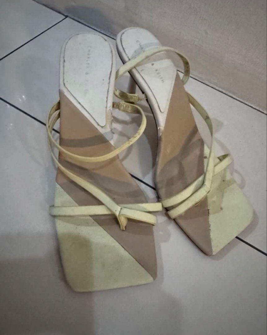 Charles & Keith Two-Tone Square Toe Heeled Sandals (Category: Heels) located in Manila. Submitted by decluterthings888 (Listing ID 1464030950, Image 2). Description: - Brand: Charles & Keith - Style: Heeled Sandals - Design: Two-tone, Square toe, Thin straps - Heel Height: Moderate - Condition: Shows some signs of wear on soles and insoles, but plenty of life left. - Versatility: Perfect for dressing up or down..