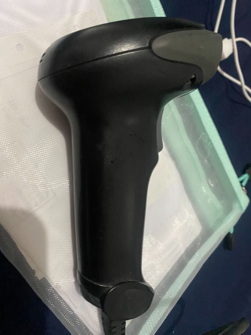 Cino Barcode Scanner (Category: Office & Business Technology) located in Taguig. Submitted by azil16 (Listing ID 1464073320, Image 1). Description: - Brand: Cino - Type: Handheld Barcode Scanner - Indicator: Blue light shows it's powered on - Condition: Works well, ready to use - Ideal for: Inventory management, Point of Sale (POS) systems - Includes: USB cable.