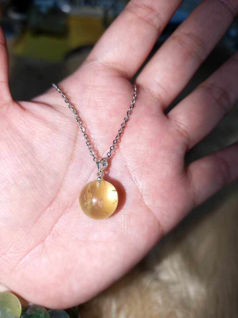 Citrine Ball Pendant 1pc only (Category: Necklaces) located in Quezon City. Submitted by piaoliangcollections.ph (Listing ID 1463953052, Image 3). Description: Made from Natural Citrine Crystal. only one piece available, get it now. Citrine is a vibrant yellow quartz crystal widely known as the "Merchant's Stone" for its powerful ties to wealth, prosperity, and positive energy. Wealth and Abundance Attracts Prosperity: Citrine is believed to draw