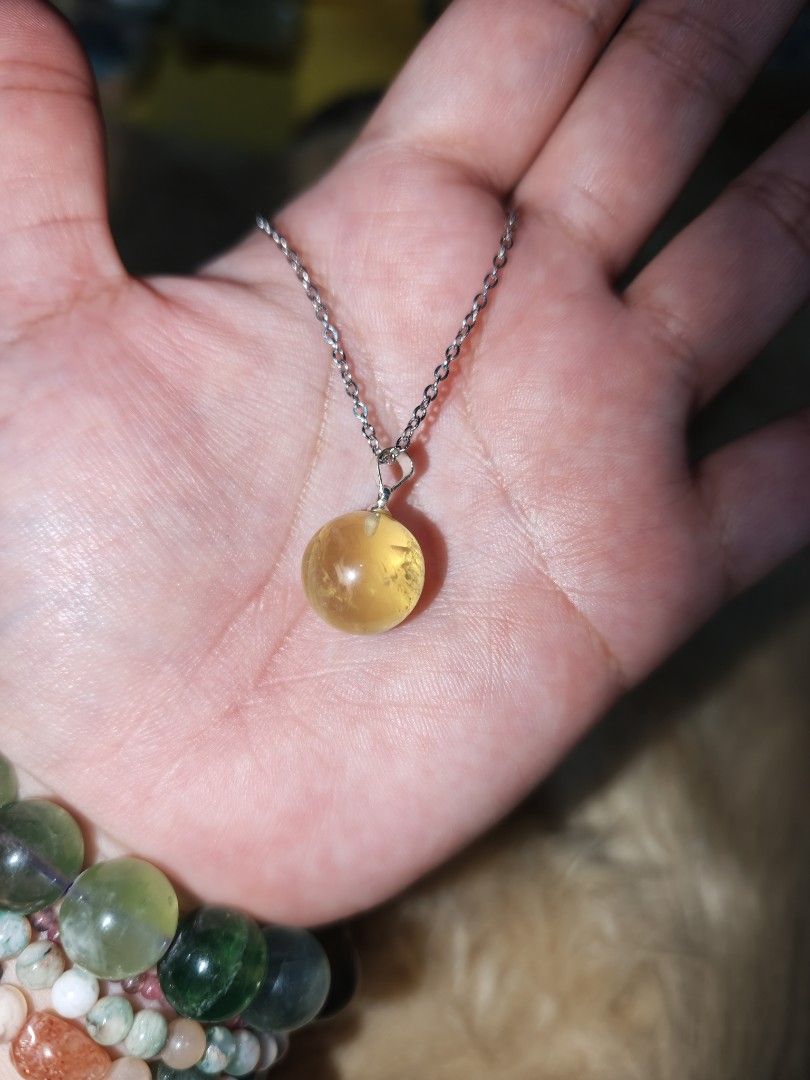 Citrine Ball Pendant 1pc only (Category: Necklaces) located in Quezon City. Submitted by piaoliangcollections.ph (Listing ID 1463953052, Image 1). Description: Made from Natural Citrine Crystal. only one piece available, get it now. Citrine is a vibrant yellow quartz crystal widely known as the "Merchant's Stone" for its powerful ties to wealth, prosperity, and positive energy. Wealth and Abundance Attracts Prosperity: Citrine is believed to draw