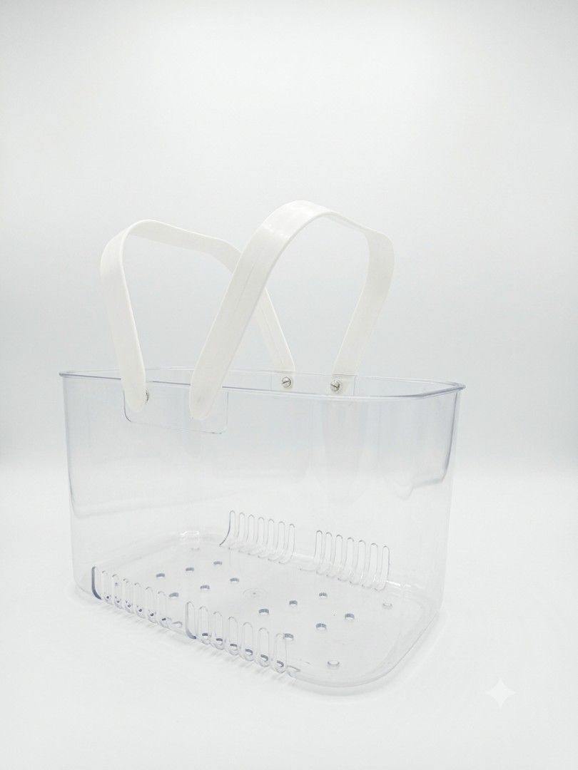 Clear Plastic Storage Basket with White Handles (Category: Storage Boxes & Baskets) located in Manila. Submitted by jules_preloved (Listing ID 1463975748, Image 1). Description: - Clear plastic storage basket - Two white handles for easy carrying - Drainage holes and raised ridges on the bottom - Ideal for organizing bathroom items, toiletries, or craft supplies - Helps keep your space tidy.