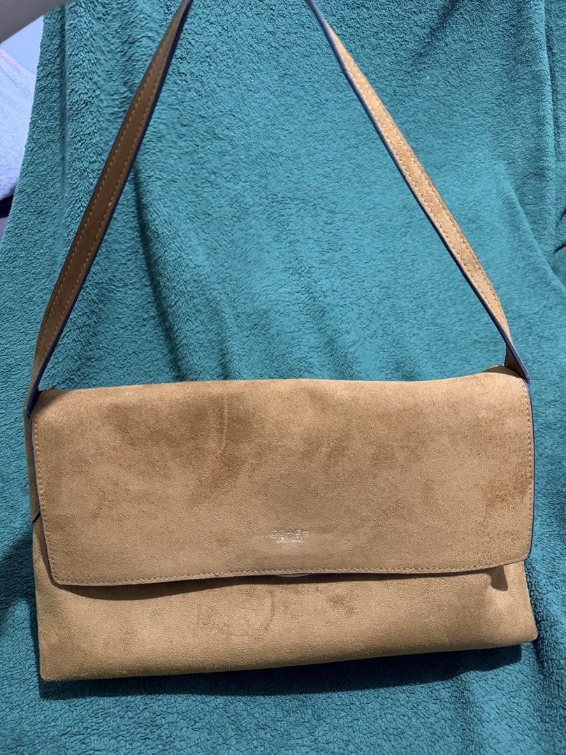Coach Chelsea 36 in suede (Category: Luxury Bags & Wallets) located in Manila. Submitted by 818marga (Listing ID 1464042976, Image 3). Description: - Authentic Coach brown suede shoulder bag - Features a beautiful, rich texture - Thin and adjustable strap for comfortable wear - Interior card with Coach logo - Perfect stylish accessory for everyday use - Ideal for carrying your daily essentials.