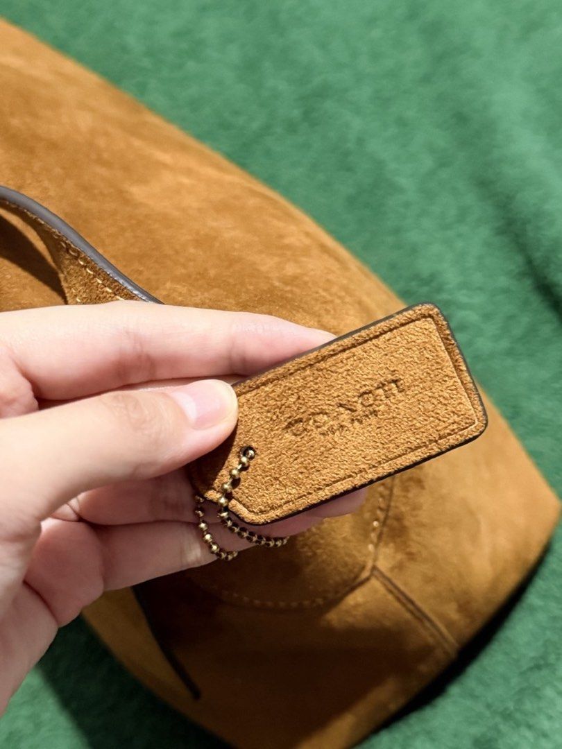 Coach Chelsea 36 in suede (Category: Luxury Bags & Wallets) located in Manila. Submitted by 818marga (Listing ID 1464042976, Image 2). Description: - Authentic Coach brown suede shoulder bag - Features a beautiful, rich texture - Thin and adjustable strap for comfortable wear - Interior card with Coach logo - Perfect stylish accessory for everyday use - Ideal for carrying your daily essentials.