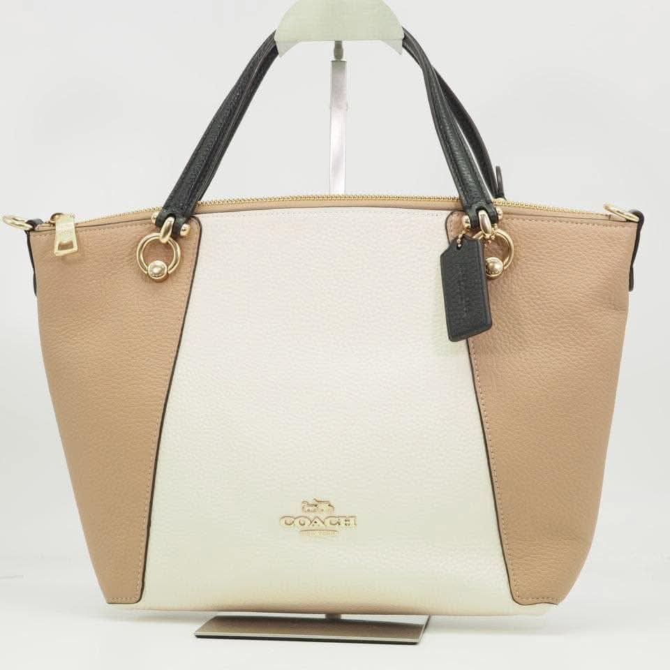 Coach Colorblock Leather Satchel Handbag (Category: Luxury Bags & Wallets) located in Paranaque City. Submitted by markandmove (Listing ID 1464116636, Image 1). Description: Kacey Satchel Colorblock Color: Chalk (Ivory / White) × Beige × Black (Gold tone hardware) Inclusions Shoulder strap, brand charm (hangtag), dust bag. well maintained. pm for additional photos. .