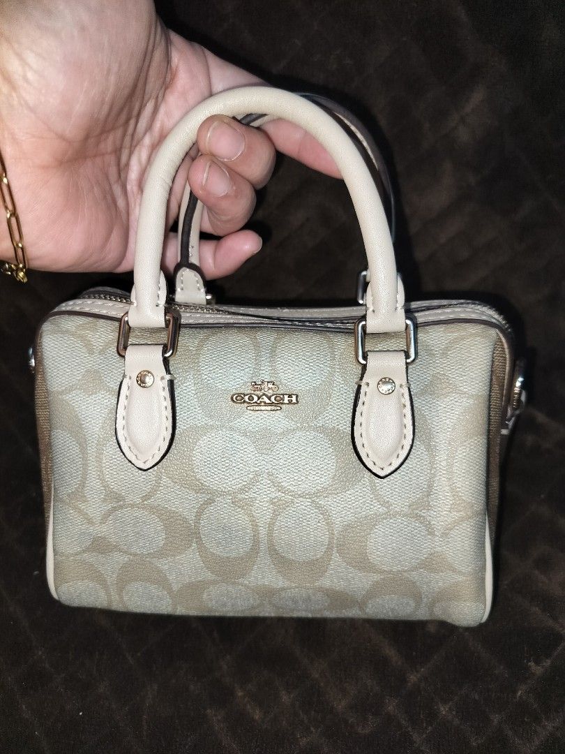 Coach Mini Rowan (Category: Shoulder Bags) located in Caloocan City. Submitted by jennielz (Listing ID 1463986366, Image 1). Description: authentic coach mini rowan -ykk zip -replaced puller -made in vietnam -clean interior -intact rubber linings -no cracking - well maintained - small mini bag (can fit mobile phone, wallet and some makeups) -no sling included but will include a replacement.