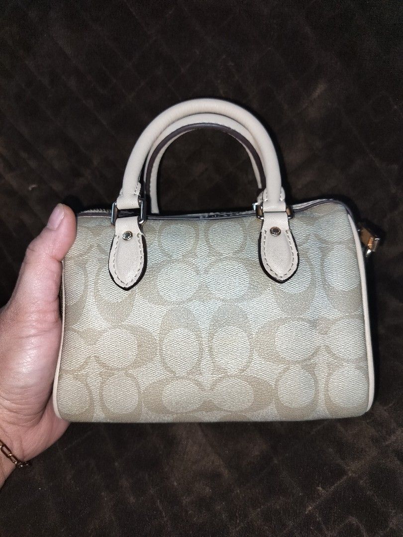 Coach Mini Rowan (Category: Shoulder Bags) located in Caloocan City. Submitted by jennielz (Listing ID 1463986366, Image 2). Description: authentic coach mini rowan -ykk zip -replaced puller -made in vietnam -clean interior -intact rubber linings -no cracking - well maintained - small mini bag (can fit mobile phone, wallet and some makeups) -no sling included but will include a replacement.
