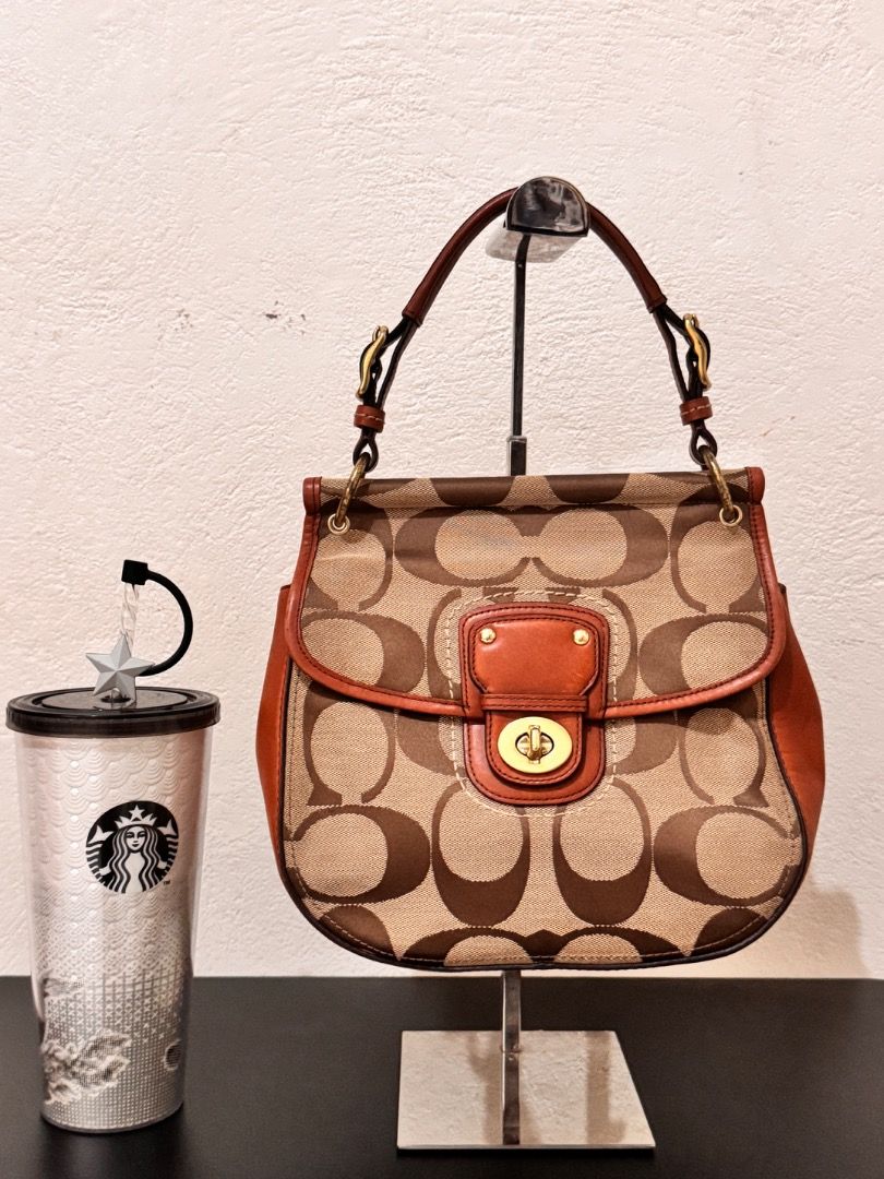 Coach Monogram Canvas Leather Trim Shoulder Bag (Category: Luxury Bags & Wallets) located in Dumaguete. Submitted by luxxe_babe (Listing ID 1464134269, Image 1). Description: SALE SALE SALE Vintage Coach monogram 2-way bag in tan and brown signature canvas with brown leather trim. Gold hardware, clasp closure, and top handle. With removable sling. No Hang tag. 😥 Clean inside and out, perfect for everyday use. Signs of usage. Overall, the bag is 