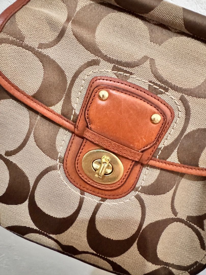 Coach Monogram Canvas Leather Trim Shoulder Bag (Category: Luxury Bags & Wallets) located in Dumaguete. Submitted by luxxe_babe (Listing ID 1464134269, Image 2). Description: SALE SALE SALE Vintage Coach monogram 2-way bag in tan and brown signature canvas with brown leather trim. Gold hardware, clasp closure, and top handle. With removable sling. No Hang tag. 😥 Clean inside and out, perfect for everyday use. Signs of usage. Overall, the bag is 