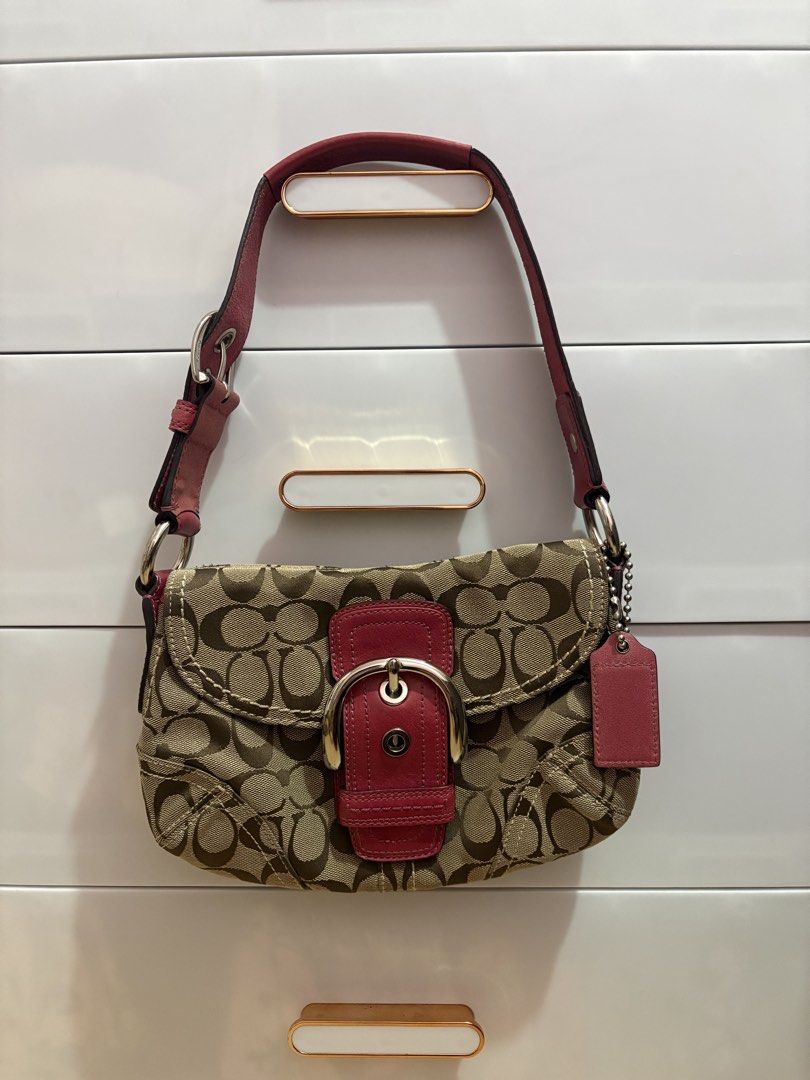 Coach Monogram Signature Canvas Shoulder Bag (Category: Luxury Bags & Wallets) located in Manila. Submitted by catherinec05859 (Listing ID 1464114087, Image 2). Description: - Authentic Coach shoulder bag - Classic monogram print - Tan and brown colorway - Genuine leather trim and strap - Secure zipper closure - Interior pocket for organization - Ideal everyday bag.