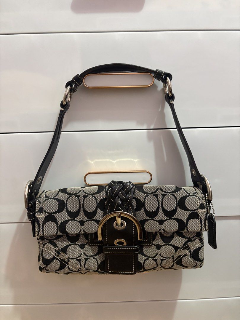 Coach Monogram Signature Canvas Shoulder Bag (Category: Luxury Bags & Wallets) located in Manila. Submitted by catherinec05859 (Listing ID 1464114087, Image 3). Description: - Authentic Coach shoulder bag - Classic monogram print - Tan and brown colorway - Genuine leather trim and strap - Secure zipper closure - Interior pocket for organization - Ideal everyday bag.