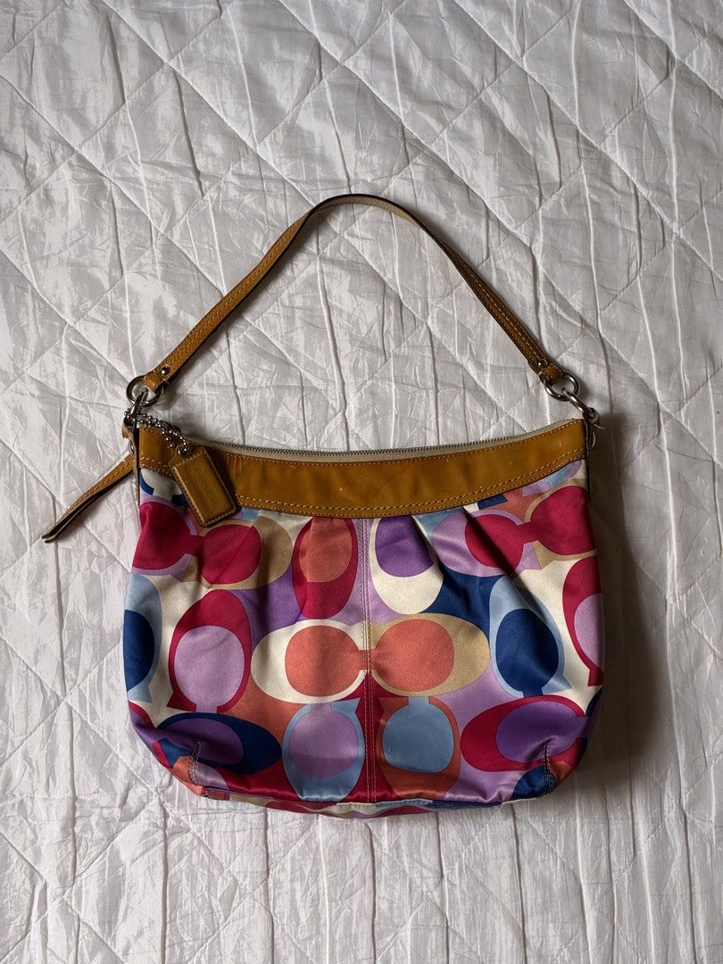 Coach Multicolor Scarf Print Hobo Bag (Category: Shoulder Bags) located in Pili. Submitted by aweyn444 (Listing ID 1463983740, Image 1). Description: - Rare - Authentic - YKK Zipper & Coded - Condition: 9.5/10 ⭐️: with hangtag | smooth pa ang zipper | no rubs or lints ang sateen ⚠️Issue: sign of use & minimal stain sa interior only mop: gcash | gotyme mod: jnt | flash express .