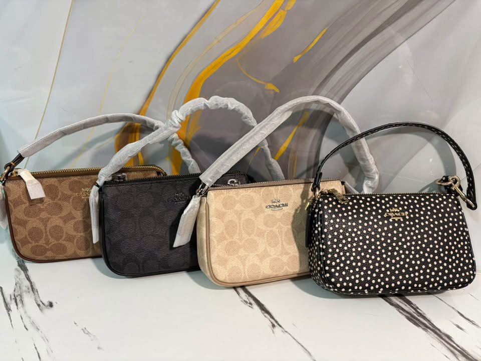 Coach Nolita 19 (Category: Purses & Pouches) located in Caloocan City. Submitted by sizzies_fashion_style (Listing ID 1463946463, Image 1). Description: - Coach Nolita 19 - Two in signature C print (tan and beige) - One in black signature C print - One black with white polka dots - All feature convenient handles - Secure zipper closures - Ideal for organizing everyday essentials.