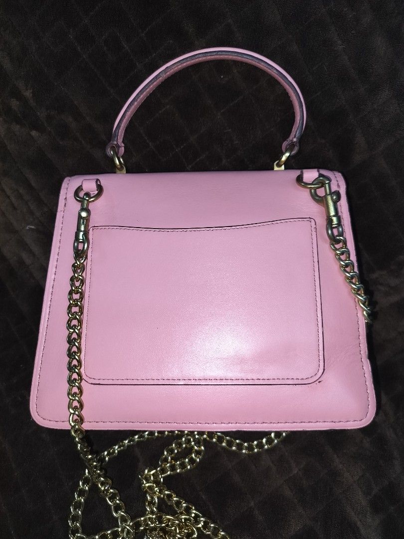 Coach Parker Tea rose (Category: Cross-body Bags) located in Caloocan City. Submitted by jennielz (Listing ID 1463983221, Image 2). Description: Coach Parker Top Handle bag accented with a distinctive jeweled tea rose turnlock closure -made in vietnam -pink -with hangtag -clean interior -clean body -minor flaws on rubberlinings (may parts na parang melted) di naman halata -goldbrass hardwares.