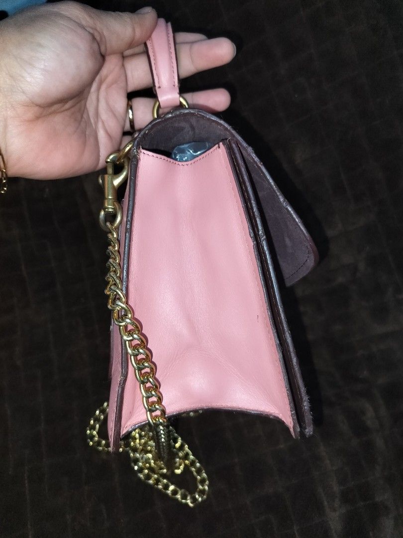 Coach Parker Tea rose (Category: Cross-body Bags) located in Caloocan City. Submitted by jennielz (Listing ID 1463983221, Image 3). Description: Coach Parker Top Handle bag accented with a distinctive jeweled tea rose turnlock closure -made in vietnam -pink -with hangtag -clean interior -clean body -minor flaws on rubberlinings (may parts na parang melted) di naman halata -goldbrass hardwares.
