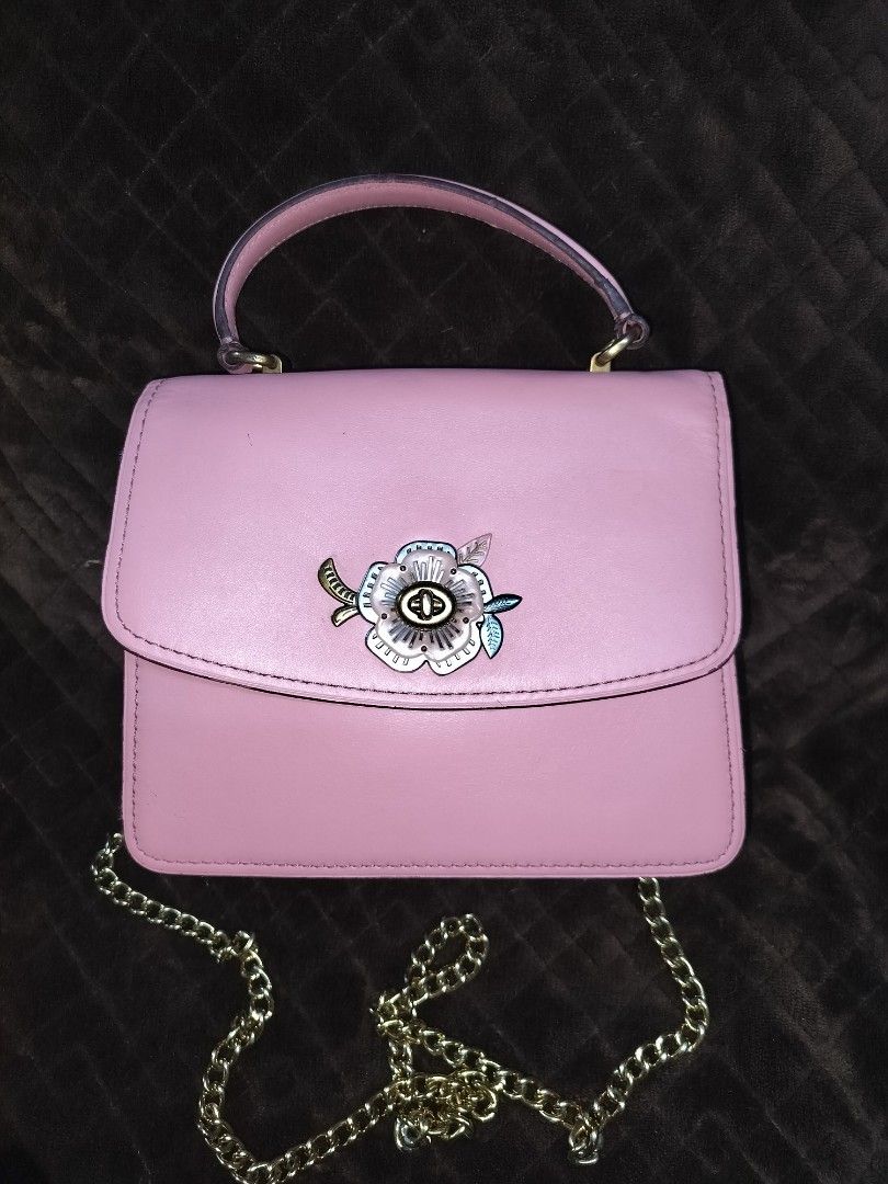 Coach Parker Tea rose (Category: Cross-body Bags) located in Caloocan City. Submitted by jennielz (Listing ID 1463983221, Image 1). Description: Coach Parker Top Handle bag accented with a distinctive jeweled tea rose turnlock closure -made in vietnam -pink -with hangtag -clean interior -clean body -minor flaws on rubberlinings (may parts na parang melted) di naman halata -goldbrass hardwares.