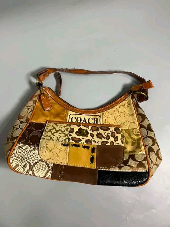 Coach Patchwork Hobo Bag (Category: Luxury Bags & Wallets) located in Mangaldan. Submitted by 4r._ashtrid (Listing ID 1464050919, Image 2). Description: - Unique Coach hobo bag - Eye-catching patchwork design - Classic Coach 'C' logo - Leopard print accents - Snake print accents - Genuine leather trim and strap - Convenient front pocket with turn-lock closure - Perfect statement accessory.