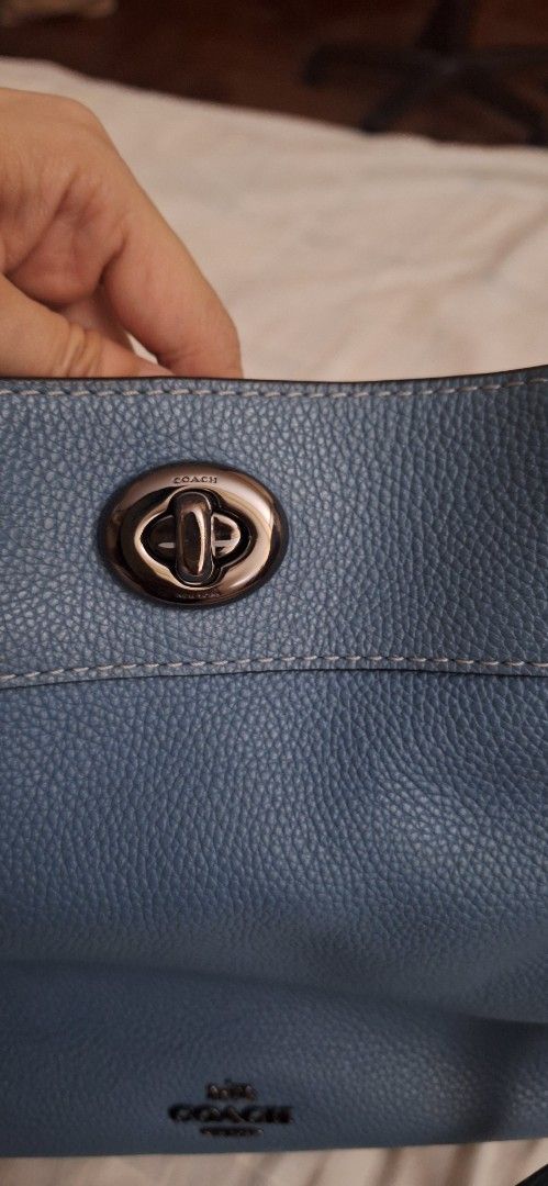Coach Pebbled Leather Shoulder Bag - Blue (Category: Luxury Bags & Wallets) located in Dasmarinas. Submitted by jdc3173 (Listing ID 1464053707, Image 2). Description: - Blue pebbled leather Coach shoulder bag - Silver hardware with turn-lock closure - Multiple interior compartments - Minor marks inside - Ideal for everyday use.
