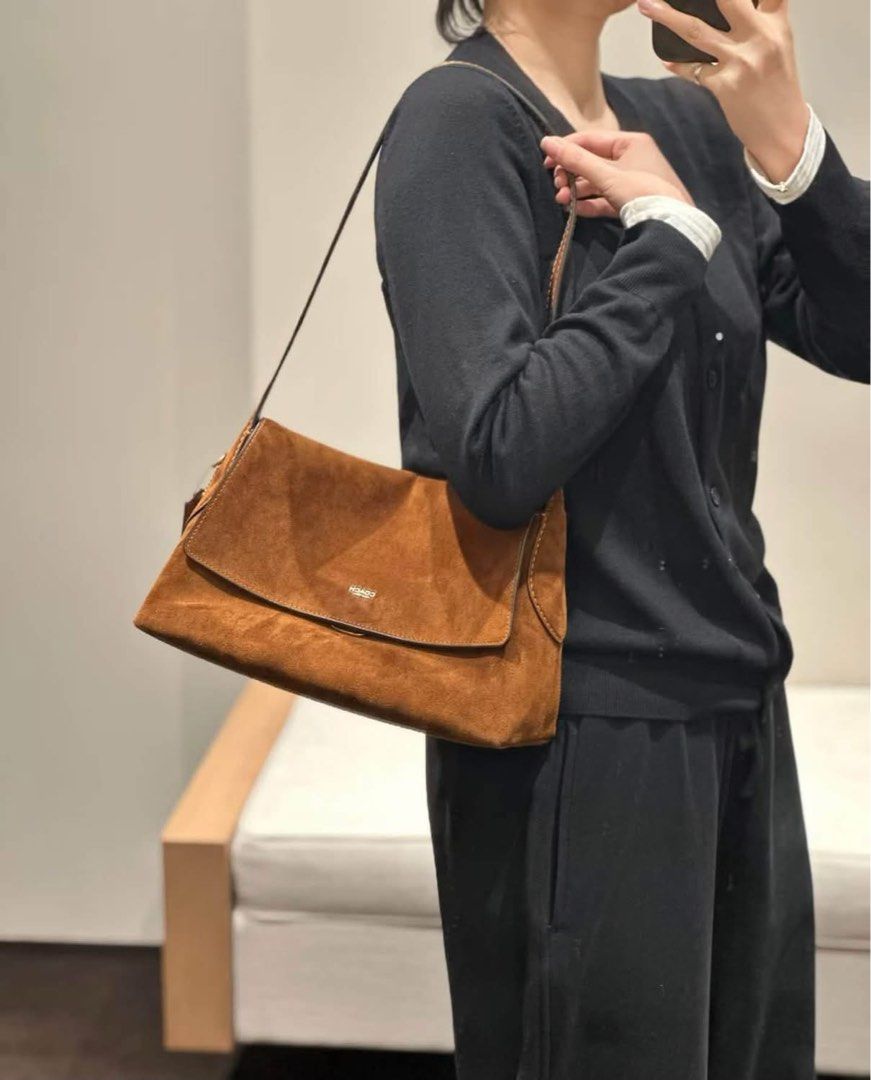 Coach Shoulder Bag - Brown Leather & Suede Options (Category: Shoulder Bags) located in Caloocan City. Submitted by brandeditemsph (Listing ID 1464040362, Image 2). Description: - Authentic Coach shoulder bag - Available colors: Brown Leather, Brown Suede, Bright Pink Suede - Ideal for everyday use - Includes a detachable strap - Please check photos for condition and details.