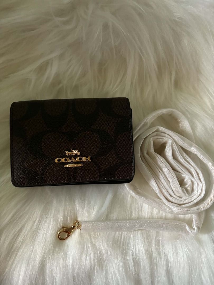 Coach Signature C Monogram Small Wallet with Strap (Category: Wallets & Card Holders) located in Davao. Submitted by airadspbls (Listing ID 1463944654, Image 1). Description: PRELOVED COACH WALLET ON CHAIN ✨️ Decluttering my coach wallet on chain. Excellent condition. 📌 RFS: not using anymore 📍 Location: Polomolok, South Cotabato 100% AUTHENTIC 💯 Money-back guarantee if proven fake. .