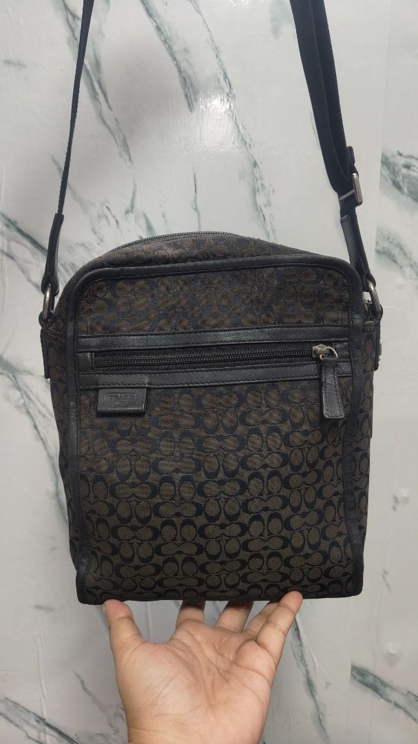 Coach Signature Jacquard Flight Bag (Category: Luxury Bags & Wallets) located in Caloocan City. Submitted by aliling30 (Listing ID 1464049922, Image 2). Description: Coach crossbody bag - Signature monogram pattern in brown and black - Genuine leather trim and strap - Secure zipper closure - Interior with black fabric lining - Minor signs of wear on zipper pull and hardware - Ideal for everyday use.