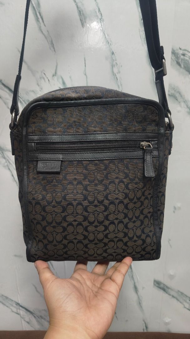 Coach Signature Jacquard Flight Bag (Category: Luxury Bags & Wallets) located in Caloocan City. Submitted by aliling30 (Listing ID 1464049922, Image 1). Description: Coach crossbody bag - Signature monogram pattern in brown and black - Genuine leather trim and strap - Secure zipper closure - Interior with black fabric lining - Minor signs of wear on zipper pull and hardware - Ideal for everyday use.