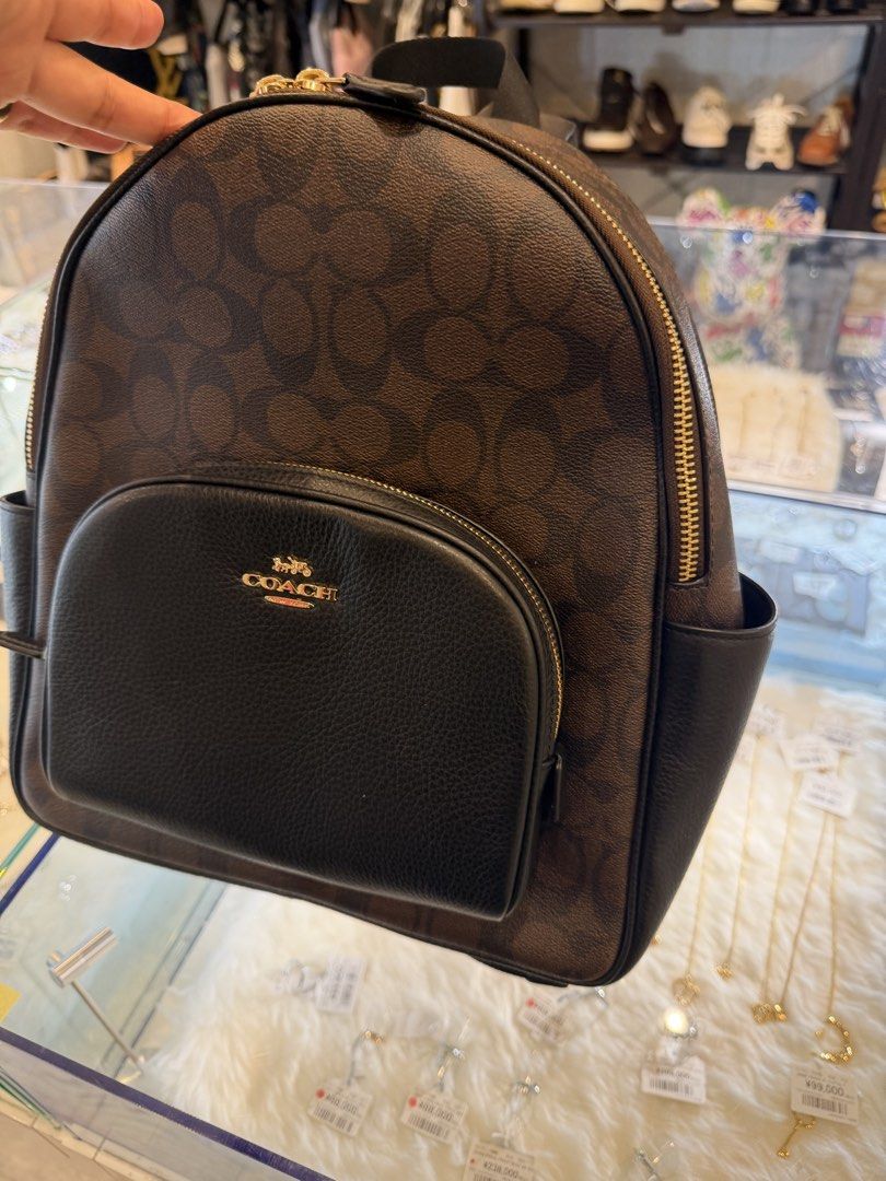 Coach Signature Monogram Backpack Brown Black (Category: Backpacks) located in Manila. Submitted by arcietan02437 (Listing ID 1464088217, Image 3). Description: - Classic Coach backpack - Brown signature monogram canvas - Black leather trim - Gold hardware - Front zip pocket - Side pockets - Spacious interior - Ideal for everyday use or travel.