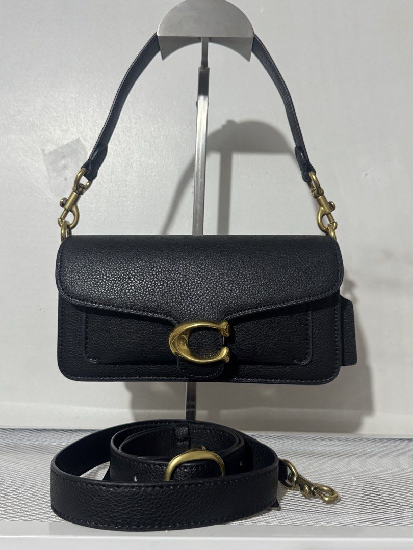 Coach Tabby Pebble Leather (Category: Luxury Bags & Wallets) located in Manila. Submitted by reinjoseph (Listing ID 1463976009, Image 1). Description: - Coach Tabby 26 bag - Color: Black - Material: Pebble Leather - Hardware: Gold - Includes: Original strap and detachable crossbody strap - Features: Classic C logo on the front - Interior: Spacious for essentials - Versatile: Ideal for day or night use - With dustbag.