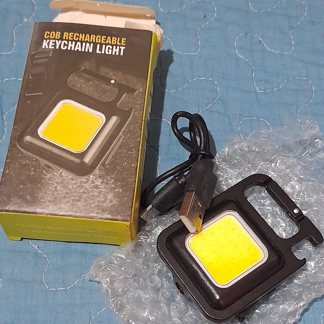 COB Rechargeable Keychain Light with Carabiner (Category: Lighting) located in Bocaue. Submitted by marajapansurplus (Listing ID 1463974388, Image 1). Description: - Super bright COB light - Rechargeable via USB - Built-in carabiner clip for easy attachment - Magnetic base for hands-free use - Ideal for camping, emergencies, and everyday carry (EDC) - Comes with USB charging cable.