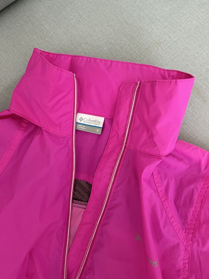 Columbia Pink Hooded Lightweight Rain Jacket (Category: Coats, Jackets and Outerwear) located in Lipa City. Submitted by pauline0303 (Listing ID 1464134054, Image 3). Description: - Bright pink Columbia jacket - Size S - Features a hood and full zip front - Lightweight material, ideal for rainy days or as a windbreaker - Two front pockets - Made in Vietnam - Perfect for outdoor activities.