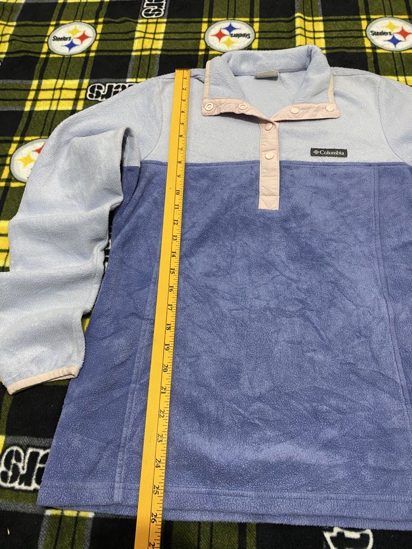 COLUMBIA,Fleece sweatshirt (Category: Coats, Jackets and Outerwear) located in Cavite. Submitted by jc_thrift95 (Listing ID 1464049881, Image 2). Description: - a cozy Columbia colorblock fleece pullover featuring a light blue upper body and a darker purple lower half, accented with a contrasting pink snap-button placket. - Made in Vietnam - Color rate 8/10 - See pictures details for dimes..