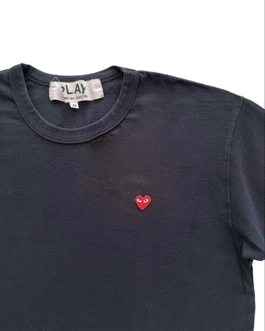 Comme de Garcons Play T Shirt (Category: Tshirts & Polo Shirts ) located in Manila. Submitted by morf_sply (Listing ID 1464020067, Image 2). Description: Play basic white t-shirt with red heart at chest. Japan origin. Featuring a round neck and short sleeves. Shoulder Width 16.5 in Pit to Pit 18 in Length 25 in Sleeves 7 in.