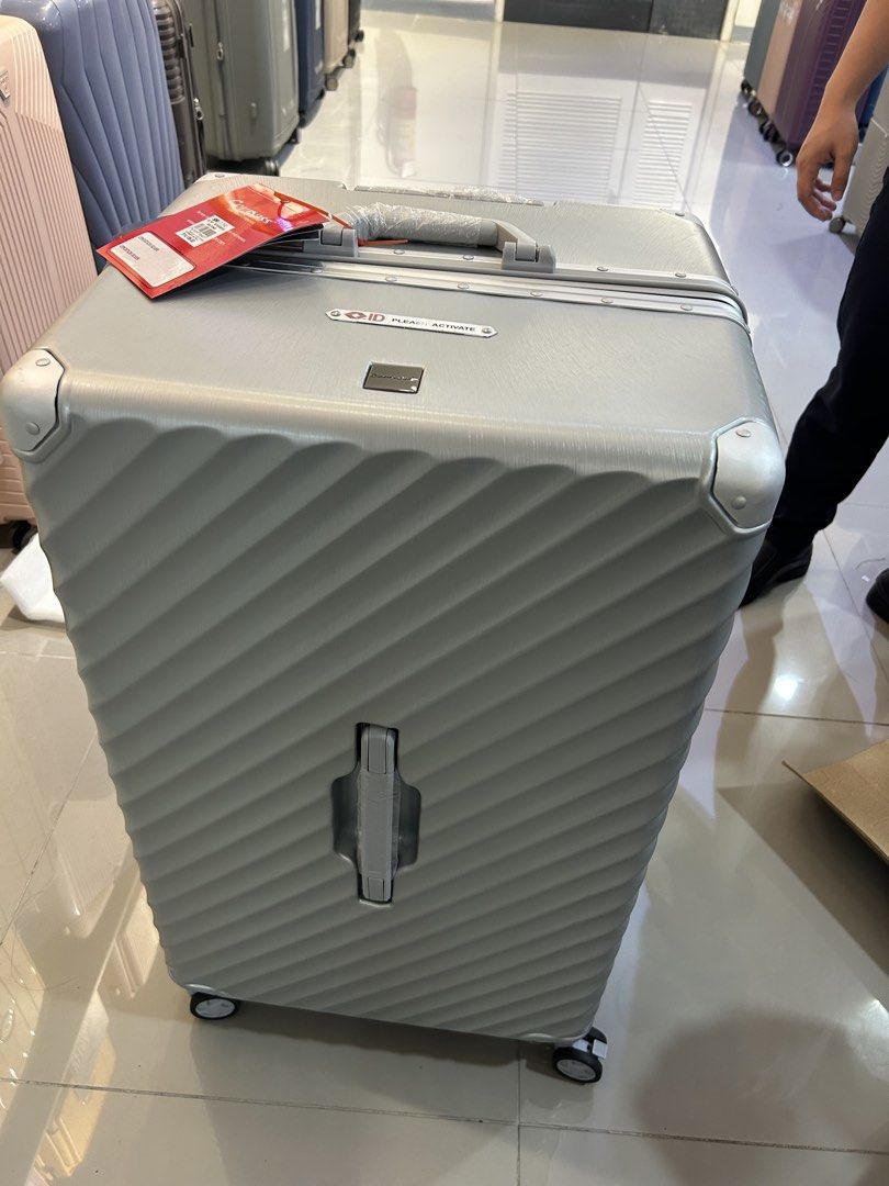 Compass Luggage Silver Spinner TSA Lock (Category: Luggage) located in San Juan City. Submitted by muil09 (Listing ID 1464062781, Image 2). Description: - Silver spinner luggage from Compass - Features a TSA lock for security - Includes Travel Sentry ID for registration - Textured exterior for durability - Smooth-rolling wheels for effortless maneuverability - Retractable handle for convenient handling.