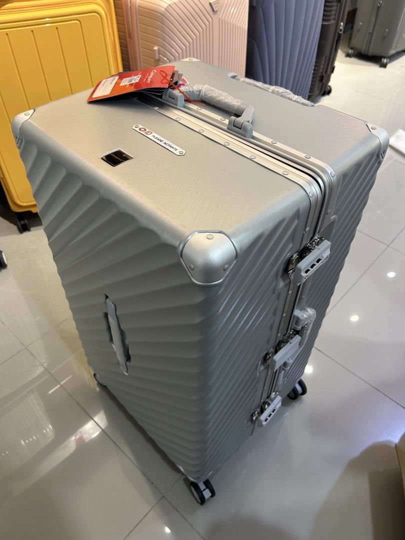 Compass Luggage Silver Spinner TSA Lock (Category: Luggage) located in San Juan City. Submitted by muil09 (Listing ID 1464062781, Image 1). Description: - Silver spinner luggage from Compass - Features a TSA lock for security - Includes Travel Sentry ID for registration - Textured exterior for durability - Smooth-rolling wheels for effortless maneuverability - Retractable handle for convenient handling.