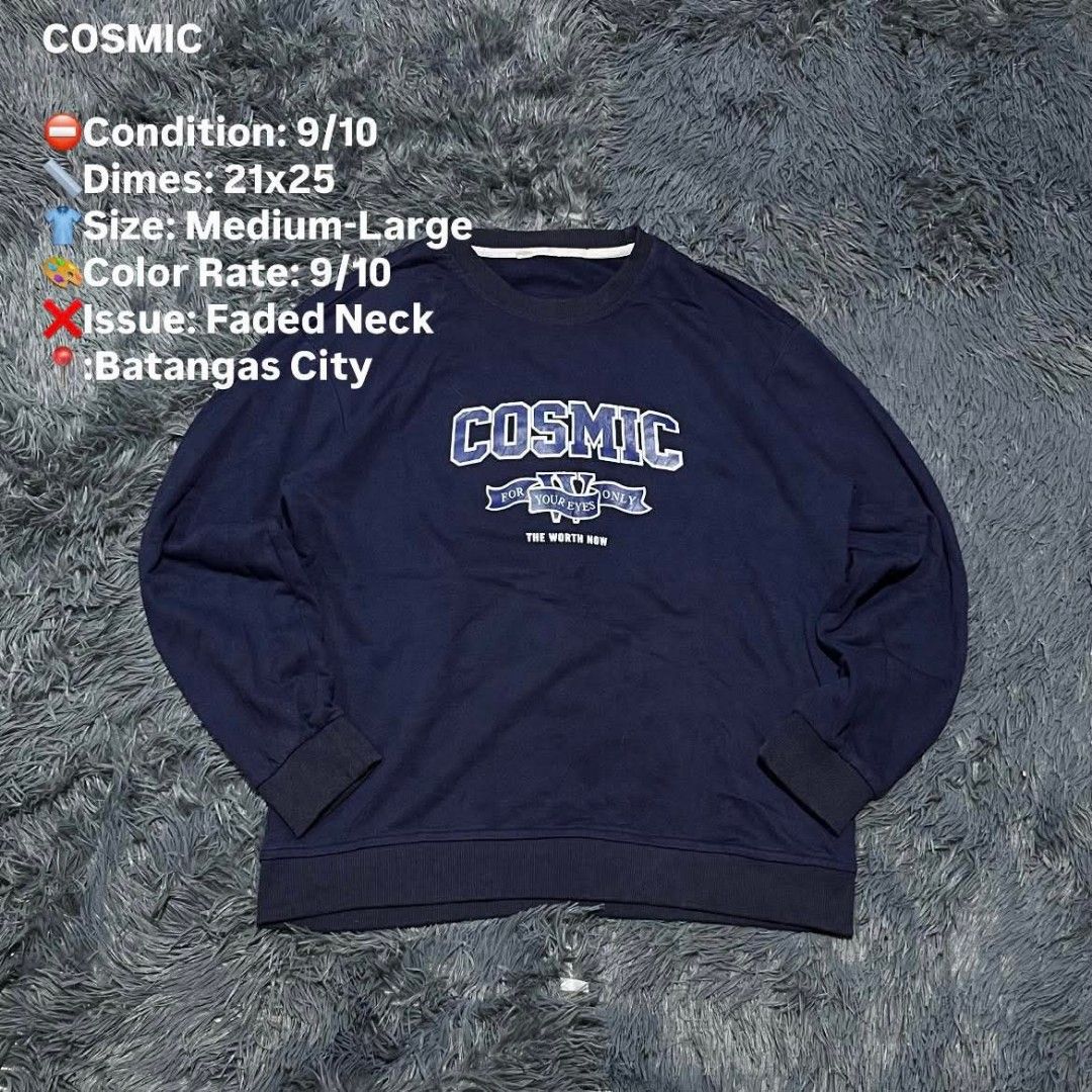 COSMIC Navy Blue Sweatshirt Medium-Large (Category: Coats, Jackets and Outerwear) located in Batangas. Submitted by jaylord_g (Listing ID 1464110511, Image 1). Description: - Brand: COSMIC - Color: Navy Blue - Size: Medium-Large (M-L) - Design: Graphic print on front: 'COSMIC FOR YOUR EYES ONLY THE WORTH NOW' - Measurements: 21 inches (width) x 25 inches (length) - Condition: Neckline shows some fading - Style: Great for casual wear.