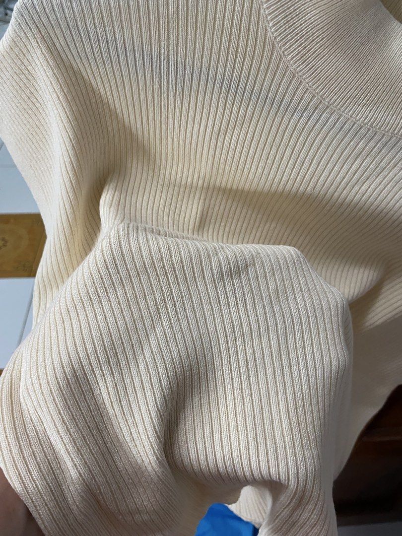 Cream Ribbed Mock Neck Cap Sleeve Cropped Top (Category: Sleeveless) located in Legazpi City. Submitted by Tfnymae (Listing ID 1463978228, Image 2). Description: ‼️SALE ‼️ - Cream colored top - Ribbed texture - Mock neck - Cap sleeves - Cropped length - Soft, stretchy knit material - Ideal for layering or wearing on its own - Pairs well with high-waisted bottoms.