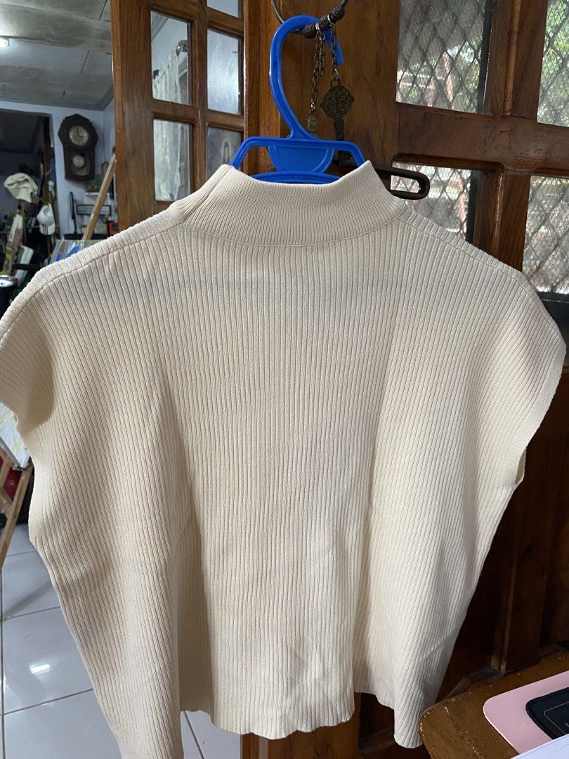 Cream Ribbed Mock Neck Cap Sleeve Cropped Top (Category: Sleeveless) located in Legazpi City. Submitted by Tfnymae (Listing ID 1463978228, Image 3). Description: ‼️SALE ‼️ - Cream colored top - Ribbed texture - Mock neck - Cap sleeves - Cropped length - Soft, stretchy knit material - Ideal for layering or wearing on its own - Pairs well with high-waisted bottoms.