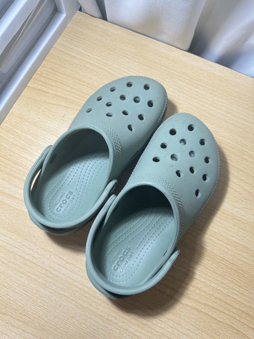 Crocs Classic Clog Sage Green (Category: Babies & Kids Fashion) located in Las Pinas. Submitted by lemartinshop (Listing ID 1464033723, Image 1). Description: - Classic Crocs clogs - Sage green color - Size C13 - Iconic comfort footbed - Durable sole with classic tread for grip - Easy to clean and wear - Ideal for everyday use.