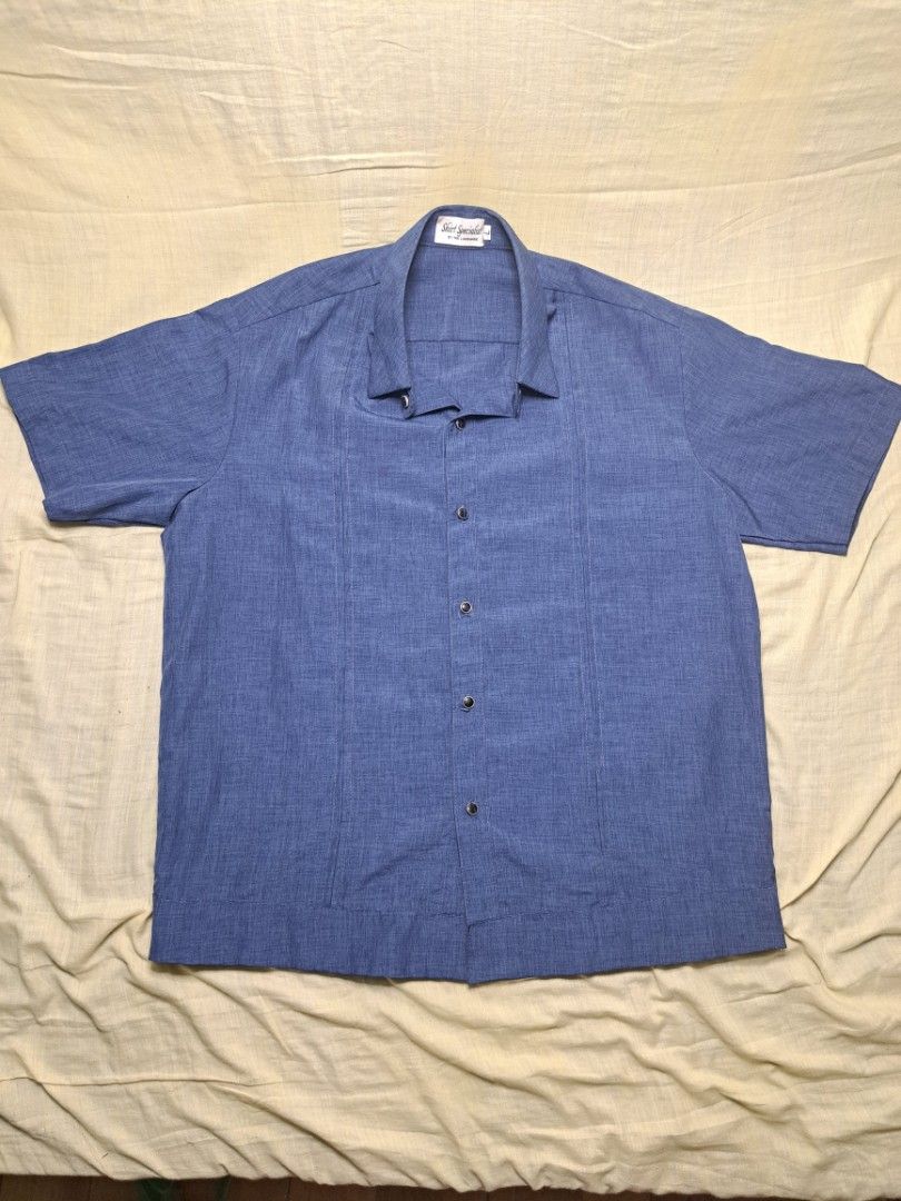 Cropped Polo (Large) (Category: Tshirts & Polo Shirts ) located in Manila. Submitted by sainty.exe (Listing ID 1463991687, Image 1). Description: - Blue short sleeve button up shirt - Brand: Shirt Specialists by The Landmark - Size: L - Features: Textured fabric, two buttons on the side hem - Ideal for: Casual wear.