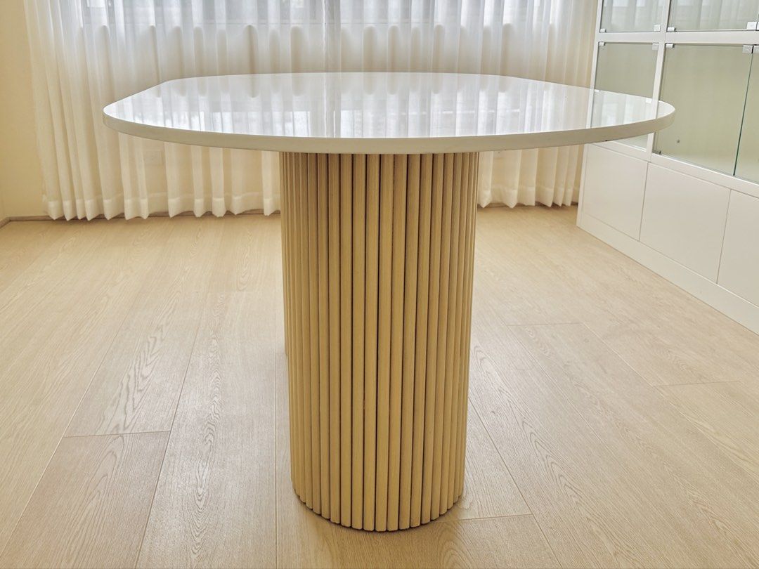 Custom 5ft Table German White Quartz on White Washed Mahogany (Category: Tables & Sets) located in Manila. Submitted by cinnamintcherry (Listing ID 1463952937, Image 2). Description: Brand new, unused in storaged, Custom oval table, 5ft W x 36"in L Legs are fluted white washed mahogany. Table top is German White Quartz. Can be dismantled for easier delivery. RSF: Ordered the wrong size Price open to negotiation. Pick up shouldered by buyer..