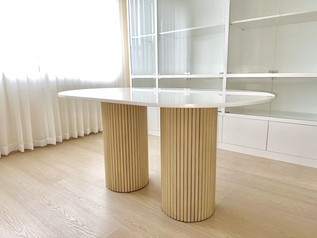 Custom 5ft Table German White Quartz on White Washed Mahogany (Category: Tables & Sets) located in Manila. Submitted by cinnamintcherry (Listing ID 1463952937, Image 1). Description: Brand new, unused in storaged, Custom oval table, 5ft W x 36"in L Legs are fluted white washed mahogany. Table top is German White Quartz. Can be dismantled for easier delivery. RSF: Ordered the wrong size Price open to negotiation. Pick up shouldered by buyer..